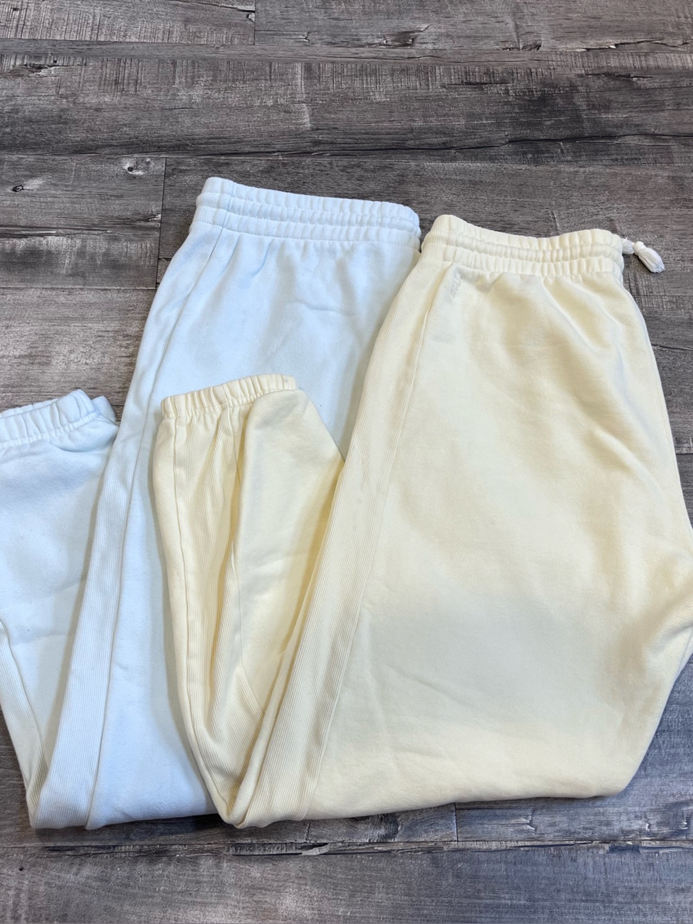 TNA Cozy Sweat Joggers in pale mint green and Pale Yellow